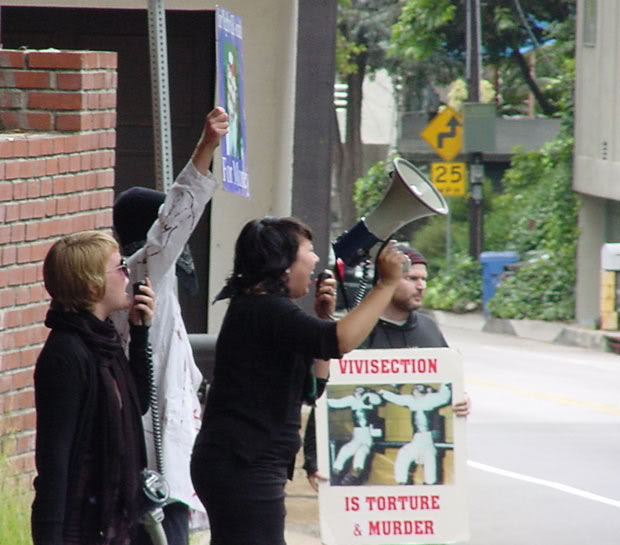 Picketers demonstrating in the street in front of a researcher's home.